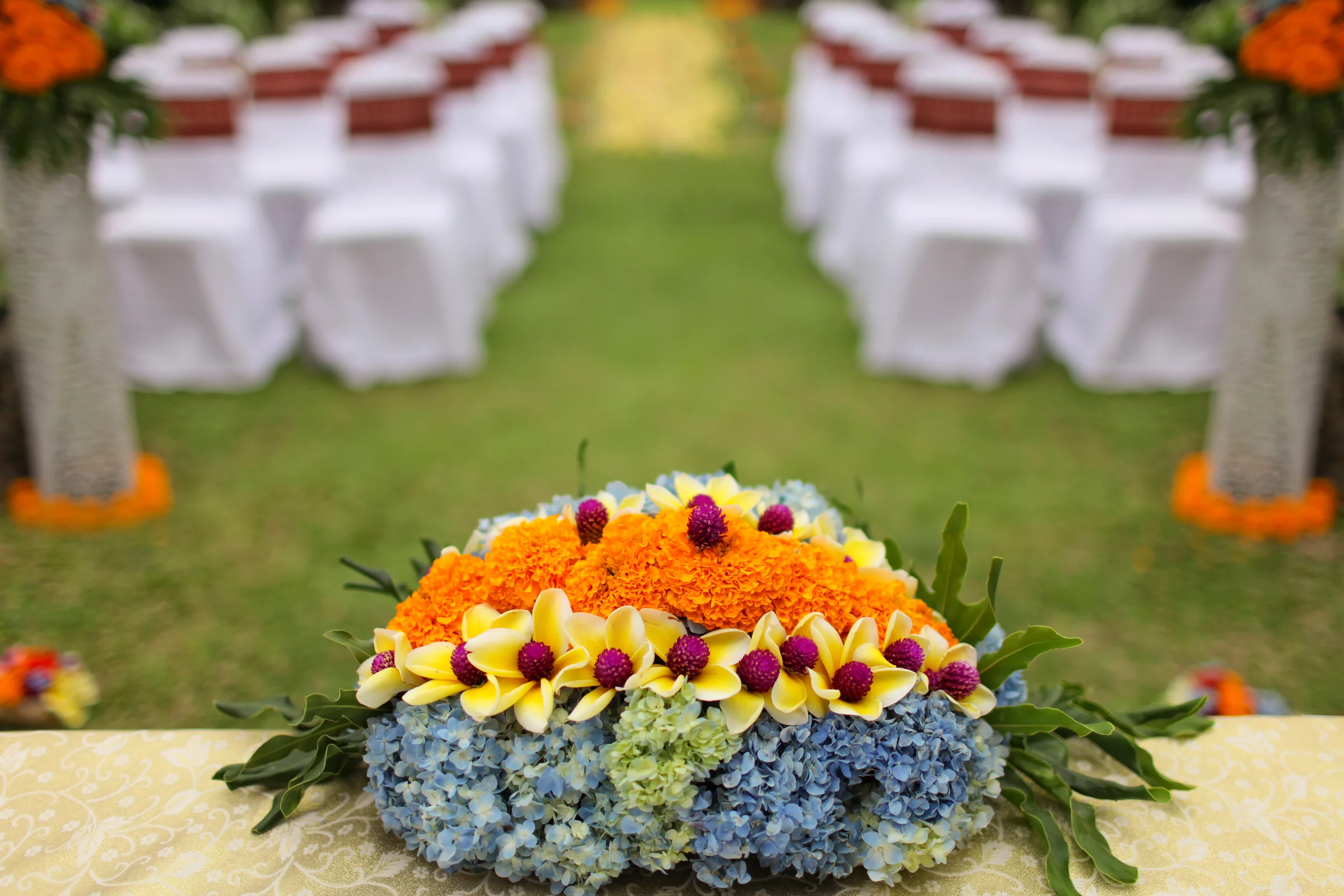Colourful Balinese wedding flowers prepared for an intimate ceremony